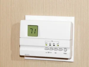 HVAC professional checking commercial temperature controls